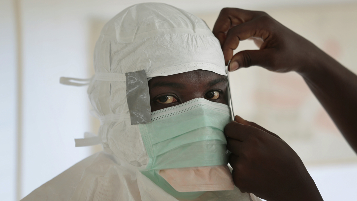 An MSF (Medecins Sans Frontieres) nurse gets prepared with Personal Protection Equipment before entering a high risk zone of MSF's Ebola isolation and treatment centre in Monrovia