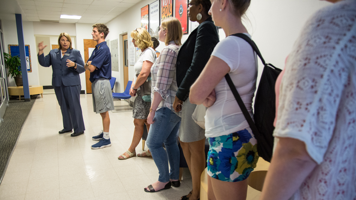  Dr. Marguerite Weber takes her new students on a tour of the college campus on their first day in her new degree completion program at Cabrini College in Radnor, Pa. The students range from 21 to 52 and come from all walks of life in pursuit of finishing their college degree. (Emily Cohen/for NewsWorks) 