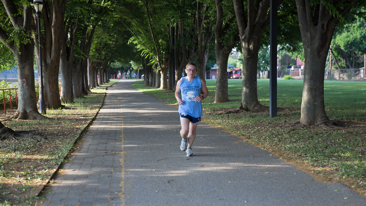  Kaylee Swanson, 27, jogs along the York rail trial a few block away from the home she plans to purchase in York, Pa.  (Lindsay Lazarski/WHYY)    