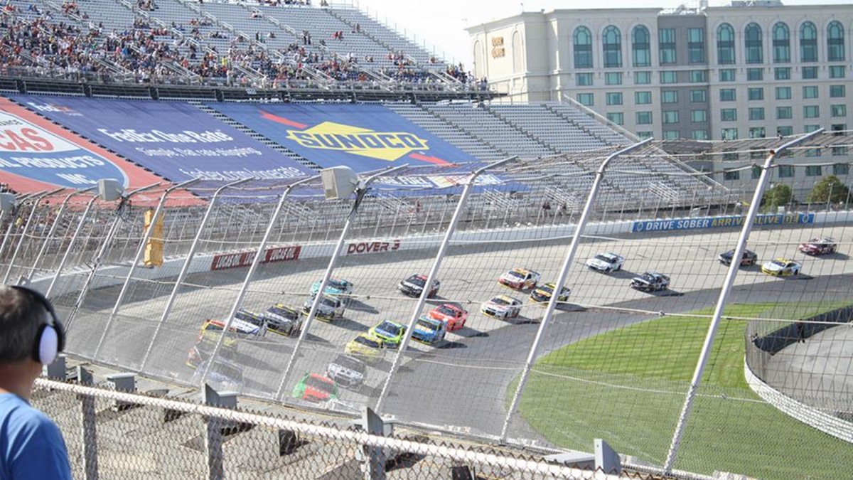  Empty seats in turn three are covered by advertisements at the September 2014 race at Dover International Speedway. (Mark Eichmann/WHYY) 