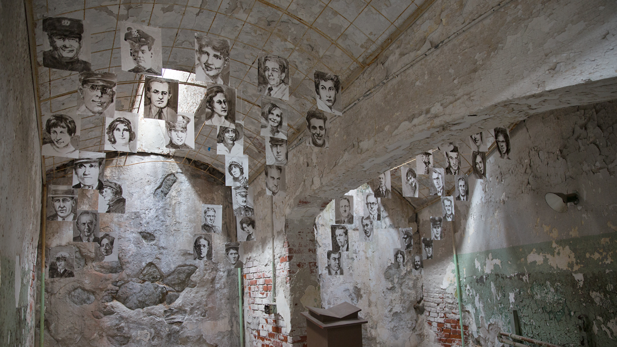  Philadelphia artist Cindy Stockton Moore created 50 translucent portraits of murder victims whose offenders served time at Eastern State Penitentiary. (Lindsay Lazarski/WHYY)  
