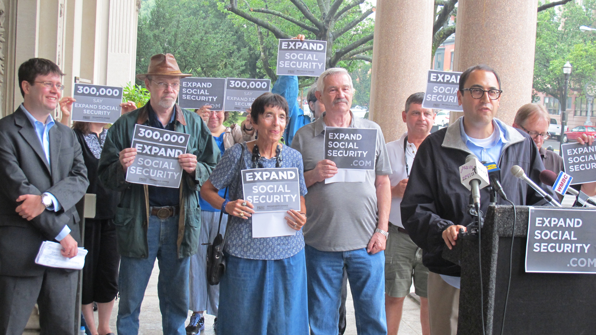  Members of progressive groups hold a news conference in front of the N.J. Statehouse to urge candidates in a special U.S. Senate election to voice support for Social Security benefit increases in August, 2013. (Phil Gregory/WHYY)  