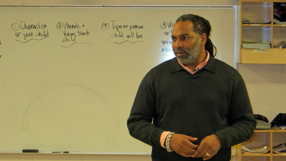 Trainer Joel Austin leads a weekly support group at the West Philadelphia YMCA for fathers working to be better dads. (Taunya English/for The Pulse)
