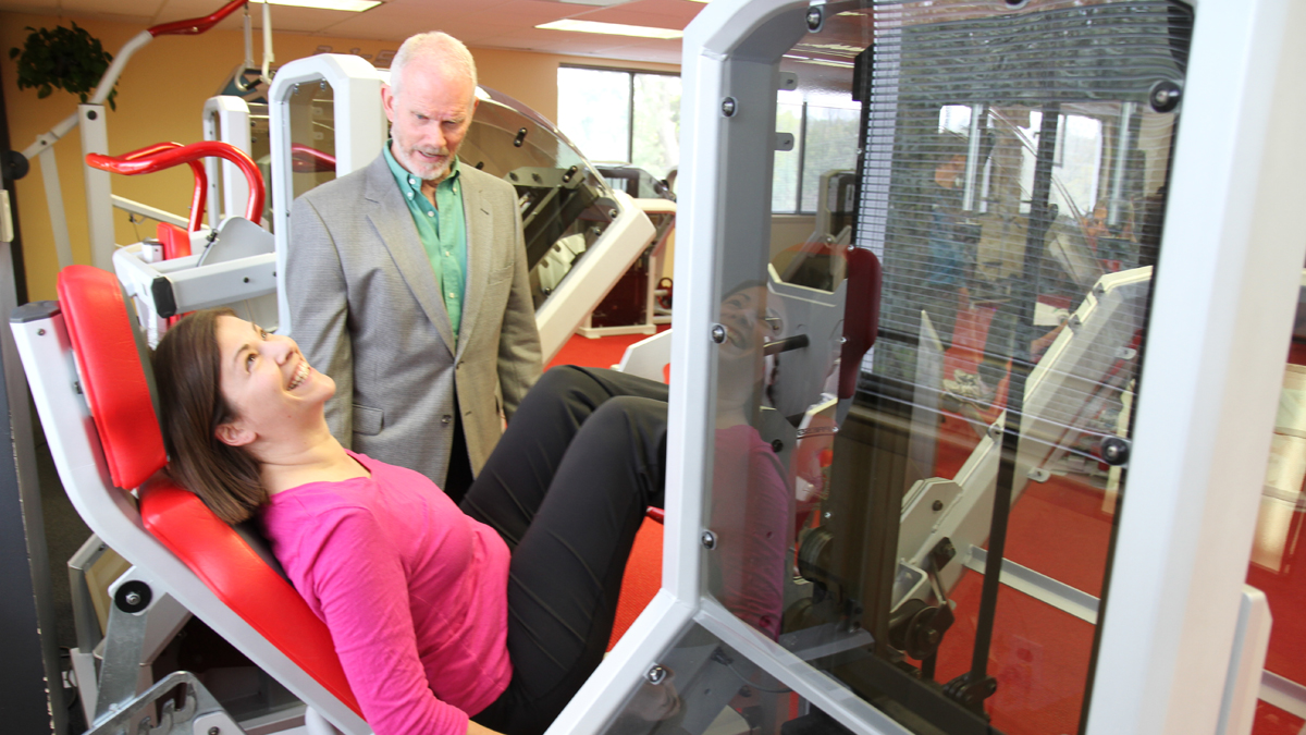 Pulse host Maiken Scott tests out one of the X- force fitness exercises with Dr. Ellington Darden