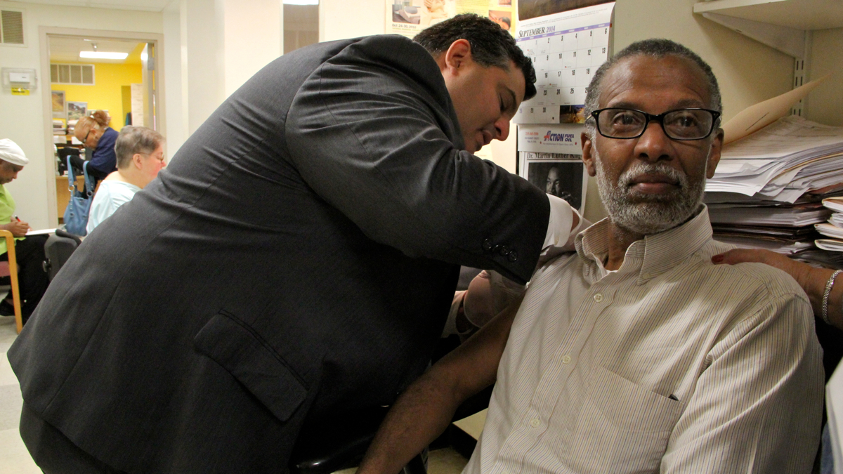  Art Haywood, 57, gets a flu shot from Dr. John Cacciamani at Center in the Park senior center in Northwest Philadelphia. (Emma Lee/WHYY) 