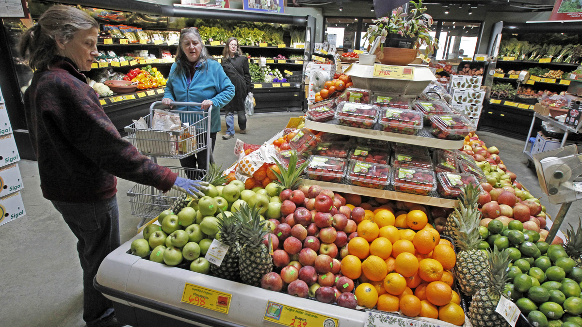 Customers are shown shopping for produce at the Hunger Mountain Co-op in Montpelier, Vt. (AP Photo/Toby Talbot, file) 