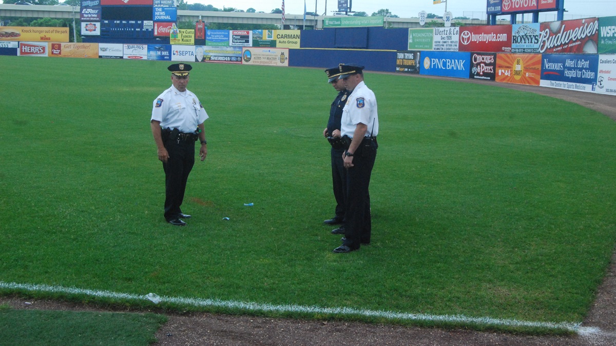  Wilmington Police investigate on the field at Frawley Stadium. (John Jankowski/for NewsWorks) 