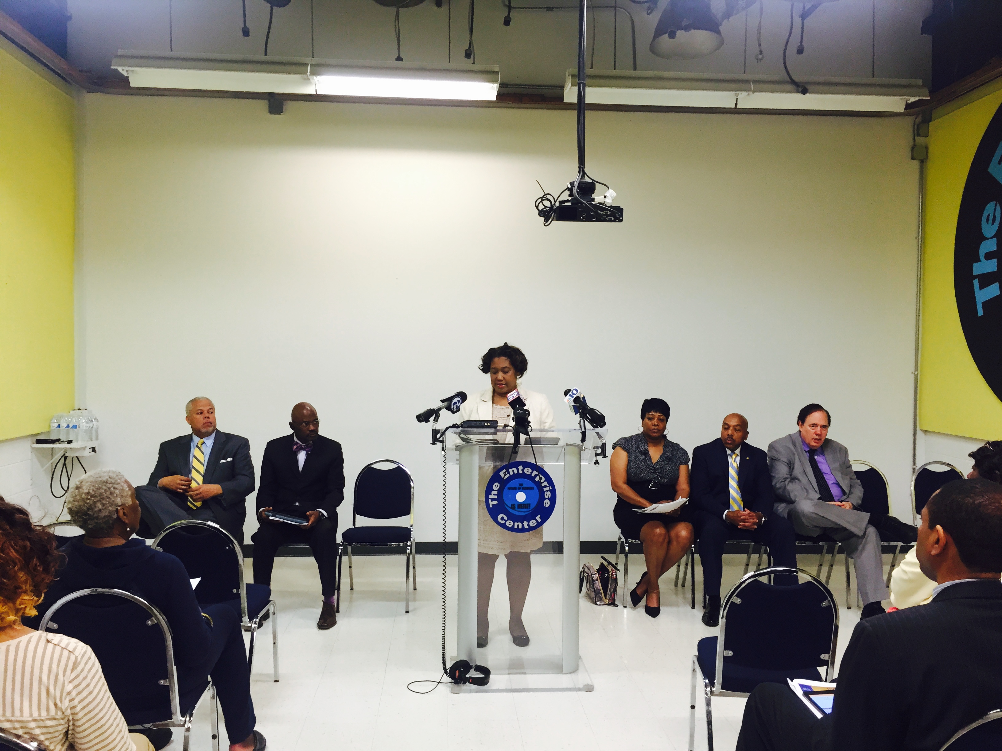  State Rep. Vanessa Lowery Brown, at the lectern, and other community leaders meet for a Monday news conference organized by the Coalition for Life Equality. (Bobby Allyn/WHYY) 