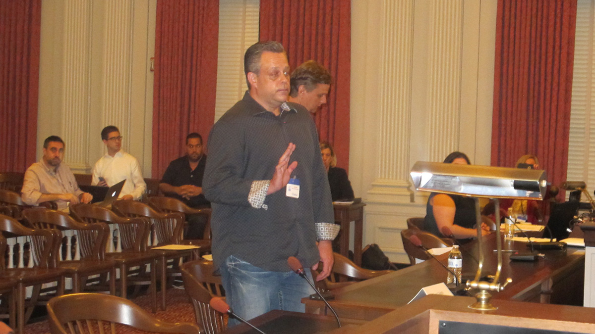 Dirt broker Frank Gillette is sworn in before asserting his Fifth Amendment right not to answer questions at the State Commission of Investigation hearing in Trenton. (Phil Gregory/WHYY))
