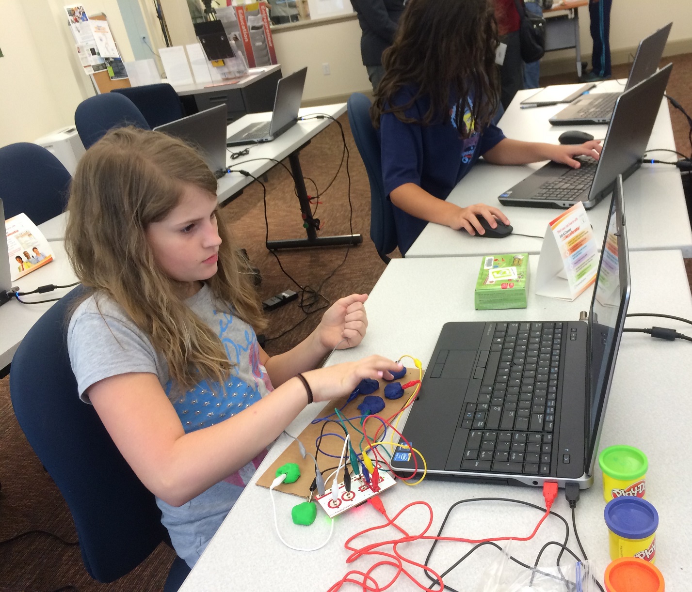 A student works at the new Inspiration Space at Wilmington Library. (photo courtesy Div. of Libraries) 