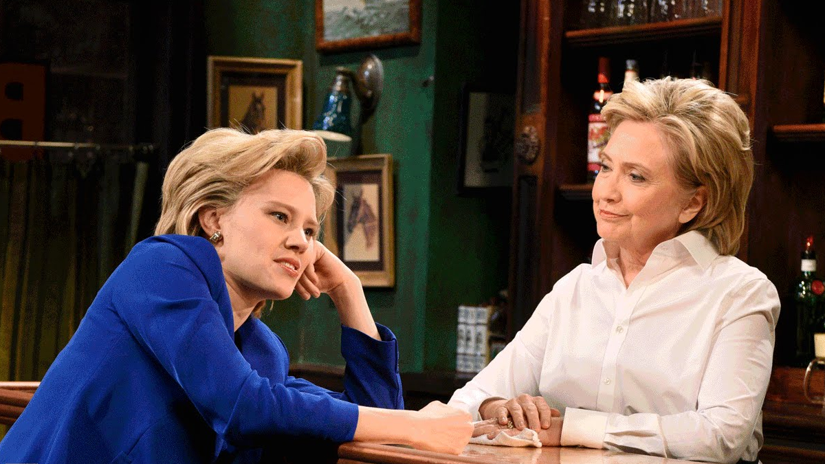  In a scene from a recent episode of 'Saturday Night Live,' the real Hilary Clinton (right) plays a bartender who listens to actor Kate McKinnon's (playing candidate Hillary Clinton) concerns about the presidential race.  