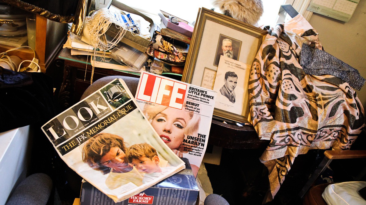Books, papers and clothes are everywhere in Marilyn Friedman's Havertown home, forcing visitors to navigate the belongings. (Kimberly Paynter/WHYY)