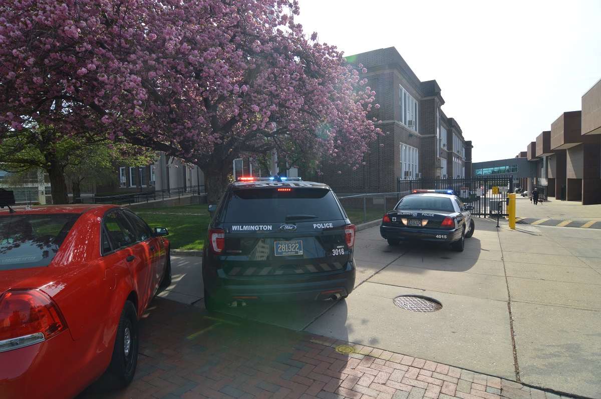 Police vehicles outside Howard High in Wilmington. (John Jankowski/for NewsWorks)