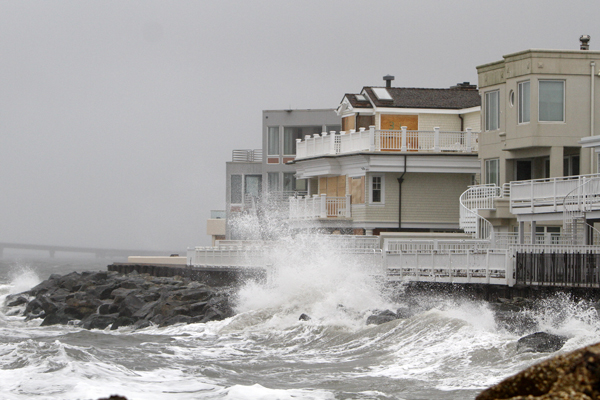  Waves crash onto the sea wall protecting homes in Longport, N.J., Sunday, Oct. 28, 2012, as Hurricane Sandy approaches the area. (AP Photo/Joseph Kaczmarek) 