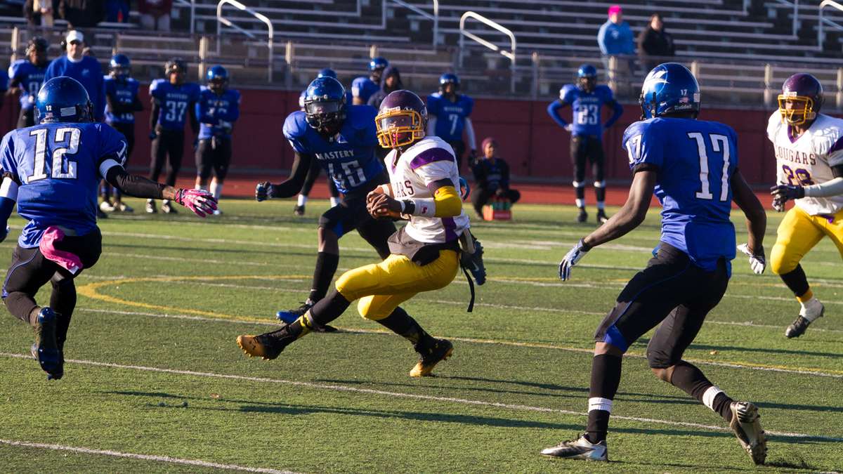  MLK QB Joseph Walker defeated teams with his arm, and his legs, during the memorable 2013 season. (Brad Larrison/for NewsWorks) 