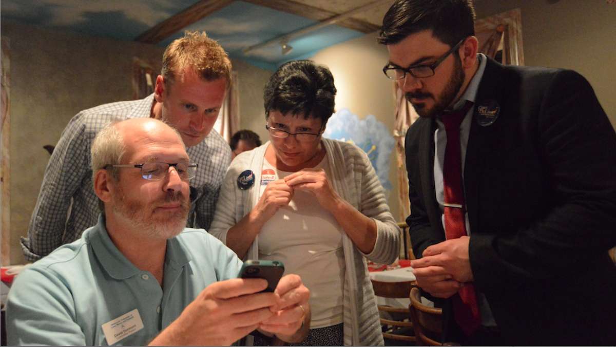  More than two hours after the polls closed, state Rep. Pam DeLissio (center) was still closely monitoring election results. She eventually won her primary over challenger Dave Henderson. (Bas Slabbers/for NewsWorks) 