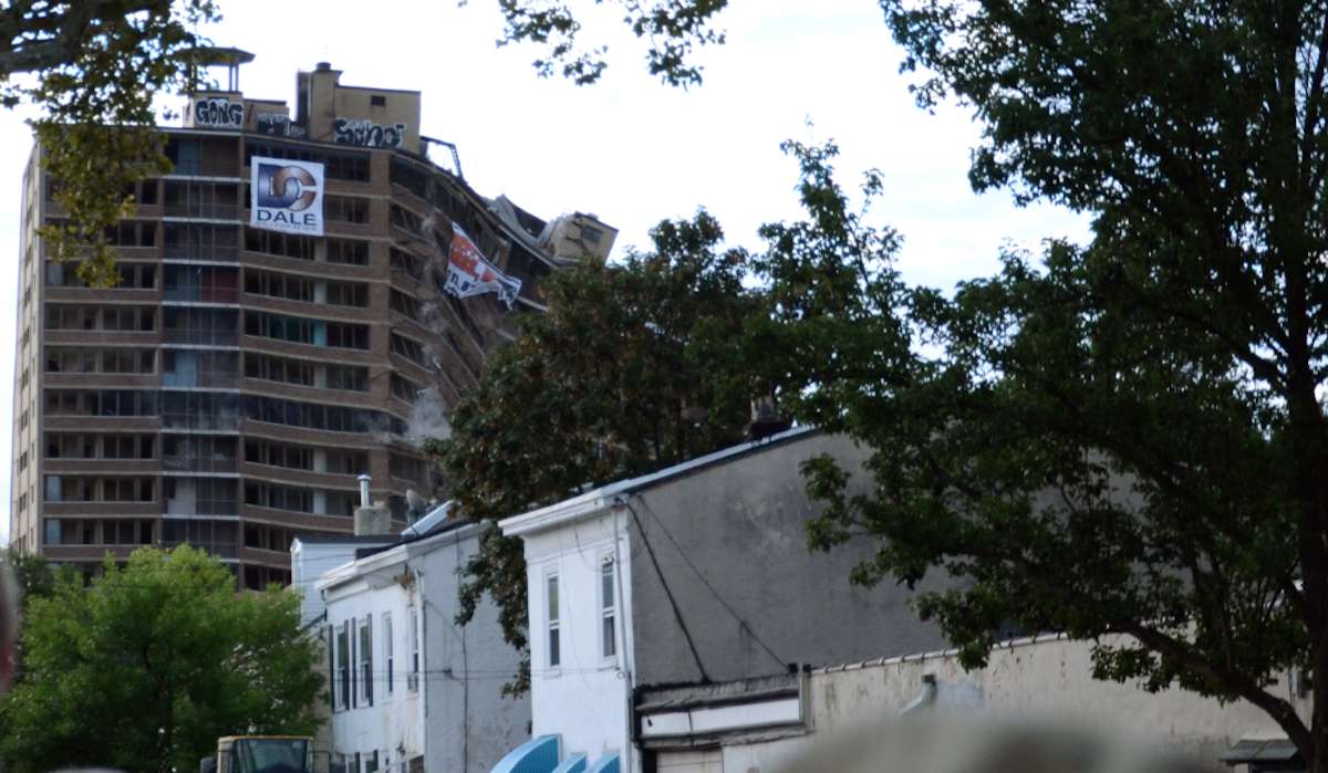  A view of the former Queen Lane Apartments tower in the middle of its September implosion. (NewsWorks, file art) 