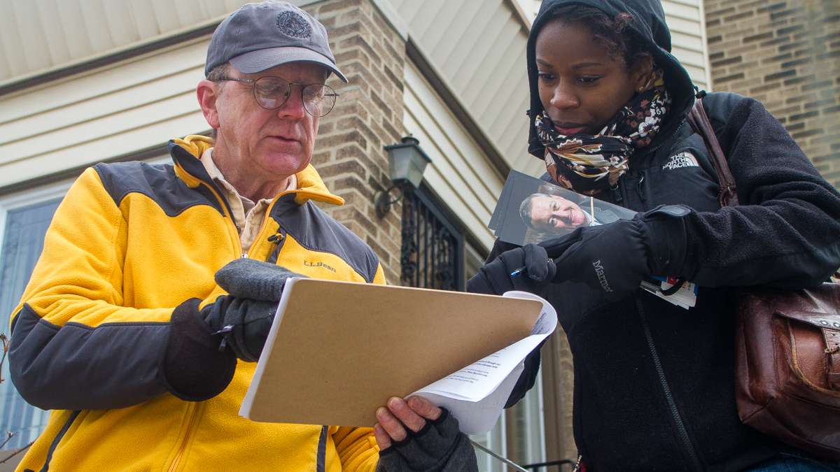  Brittany Graham and Joe Beech knock on doors in West Oak Lane canvassing for mayoral candidate Jim Kenney. (Brad Larrison/for NewsWorks) 