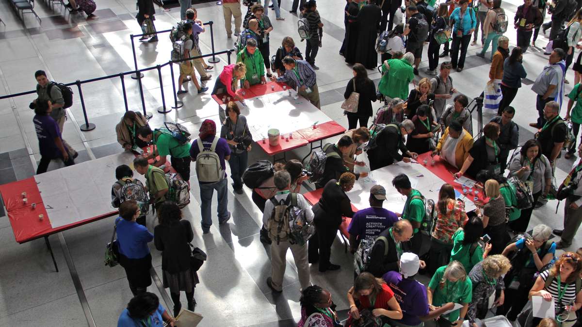 World Meeting opensAttendees at the World Meeting of Families attending the Philadelphia gathering work to set a Guinness World Record for most contributors to a paint-by-number. (Emma Lee/WHYY) 