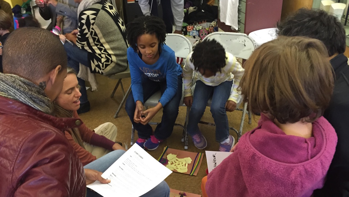  The Diggs and Solomon families share stories at a community gathering. (Courtesy of Jen Bradley) 