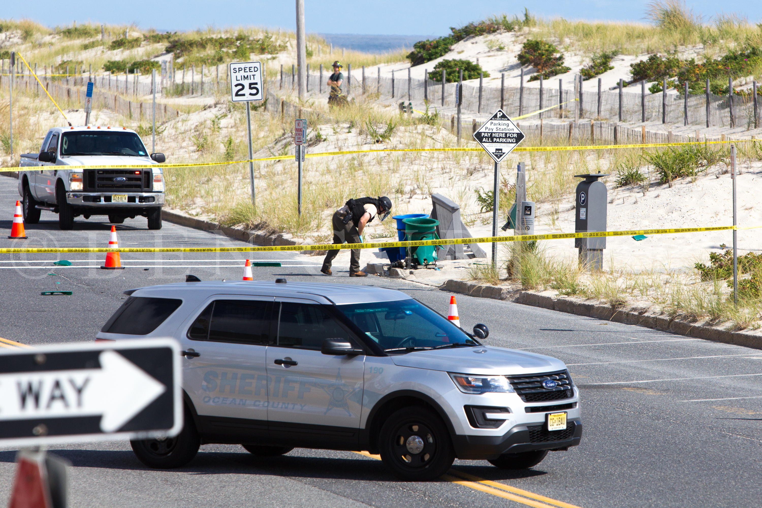 A bomb squad technician near the garbage can explosion site in Seaside Park this morning. (Photo courtesy of Ben Currie)
