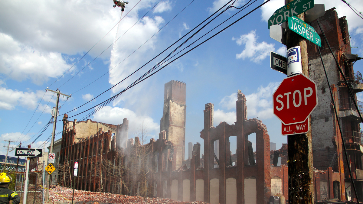  Philadelphia firefighters battle the blaze at York and Jasper streets in Kensington that killed two firefighters. (Emma Lee/for NewsWorks) 