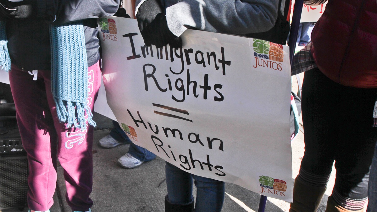 Immigration advocates protest outside the regional office of U.S. Immigration in Philadelphia (Kimberly Paynter/WHYY)