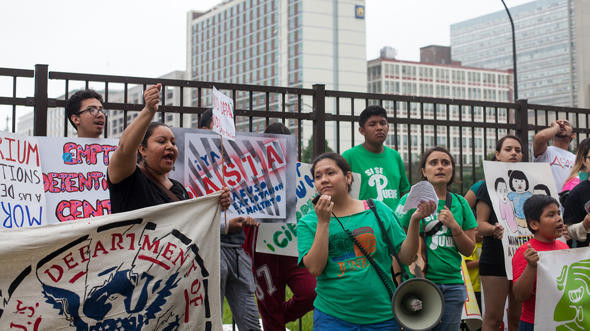 Immigrants rights groups gathered outside of the Philadelphia ICE Office to protest immigration policy. (Brad Larrison for WHYY)
