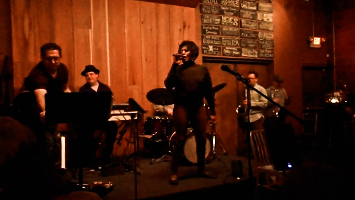 Michal Beckham sings 'I Didn't Know What Time it Was' at  (Cei Bell for NewsWorks) Victor North's jazz jam at Heritage in Northern Liberties.