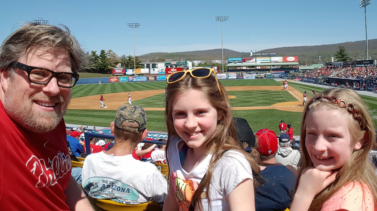 Author Jeff Bogle with his daughters at a minor league game in Reading