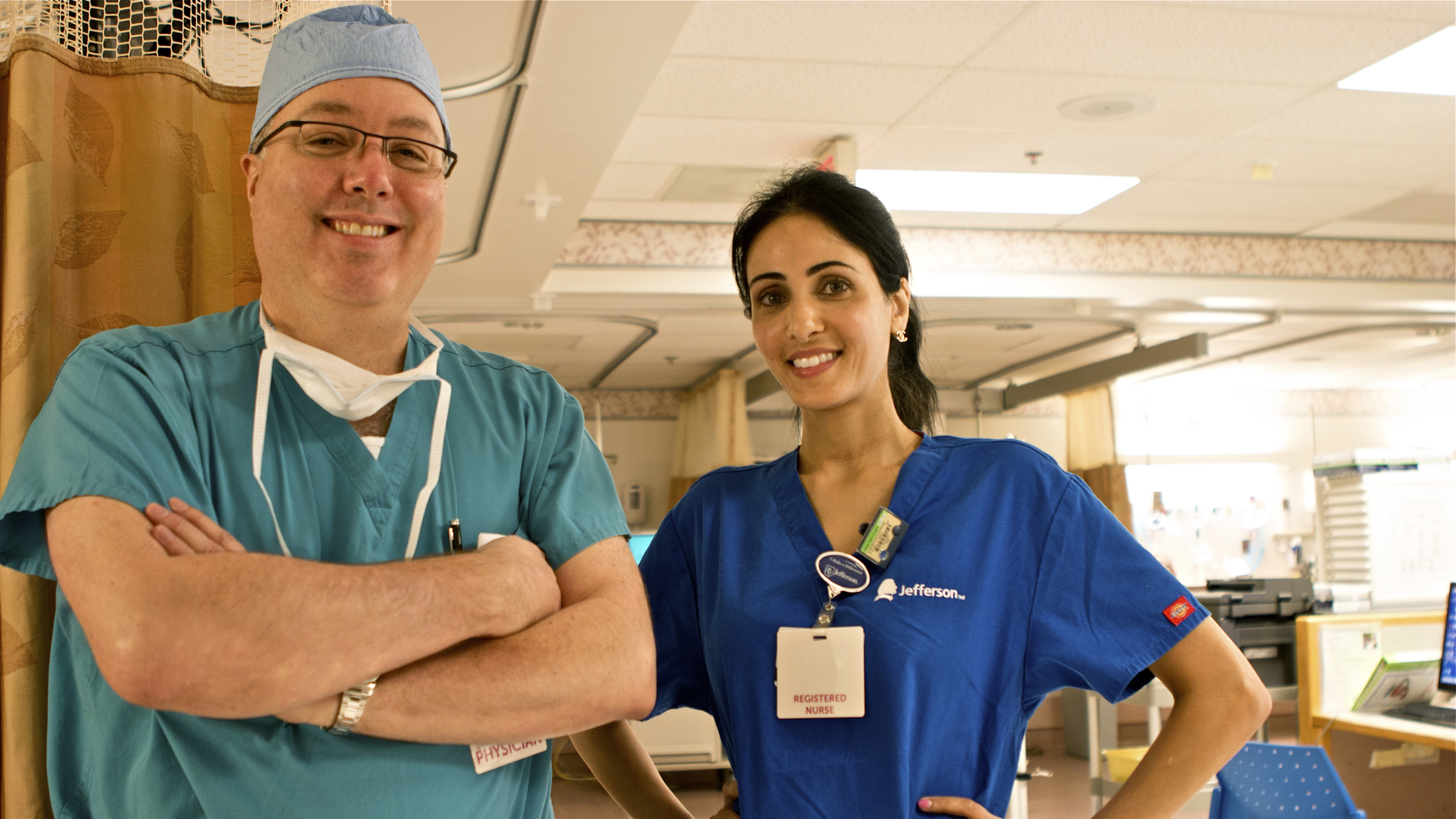 Dr. James Heitz, seen here with nurse Esmihan Almontaser, says crying after anesthesia occurs frequently enough that 'we should be aware of it as providers' even though it's not frequently documented in major anesthesiology textbooks (Karen Shakerdge/for WHYY)