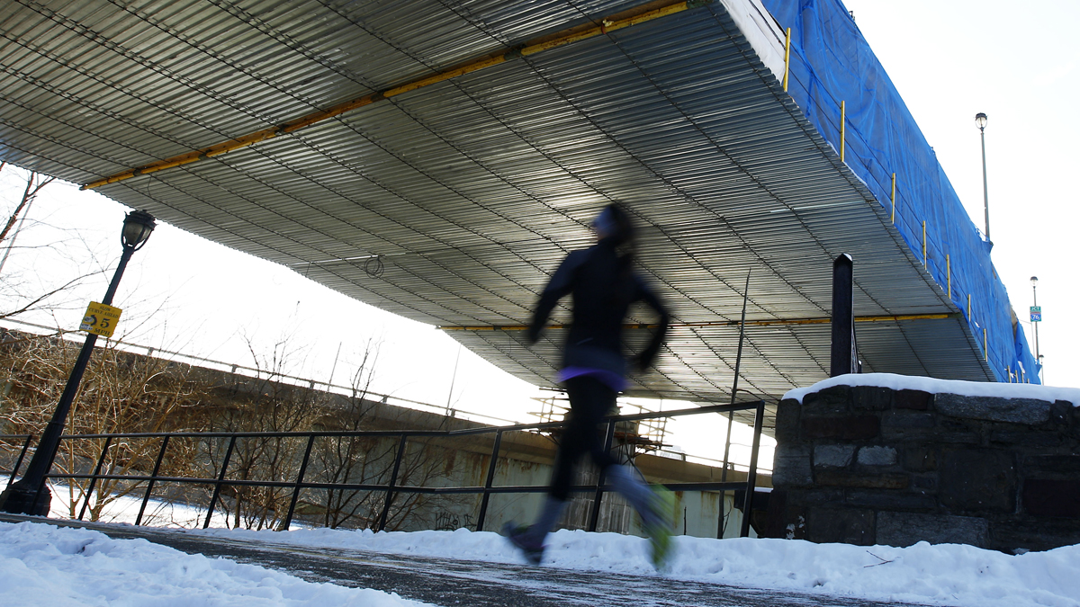  In this file image, a runner jogs beneath an overpass on the Schuylkill Banks path in Philadelphia, Pa. (AP Photo/Matt Rourke) 