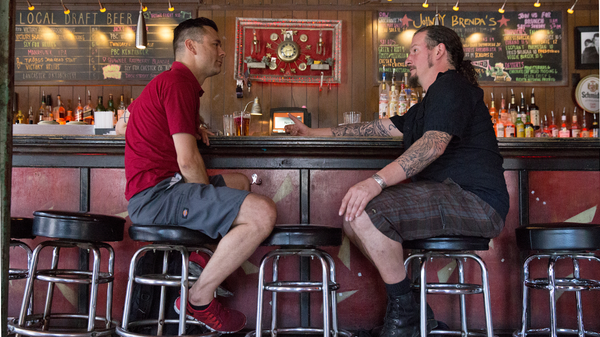  Bob Achilles (left) and Erik Boardman have a drink at Johnny Brenda's before going to bartend at another Fishtown pub. (Lindsay Lazarski/WHYY) 