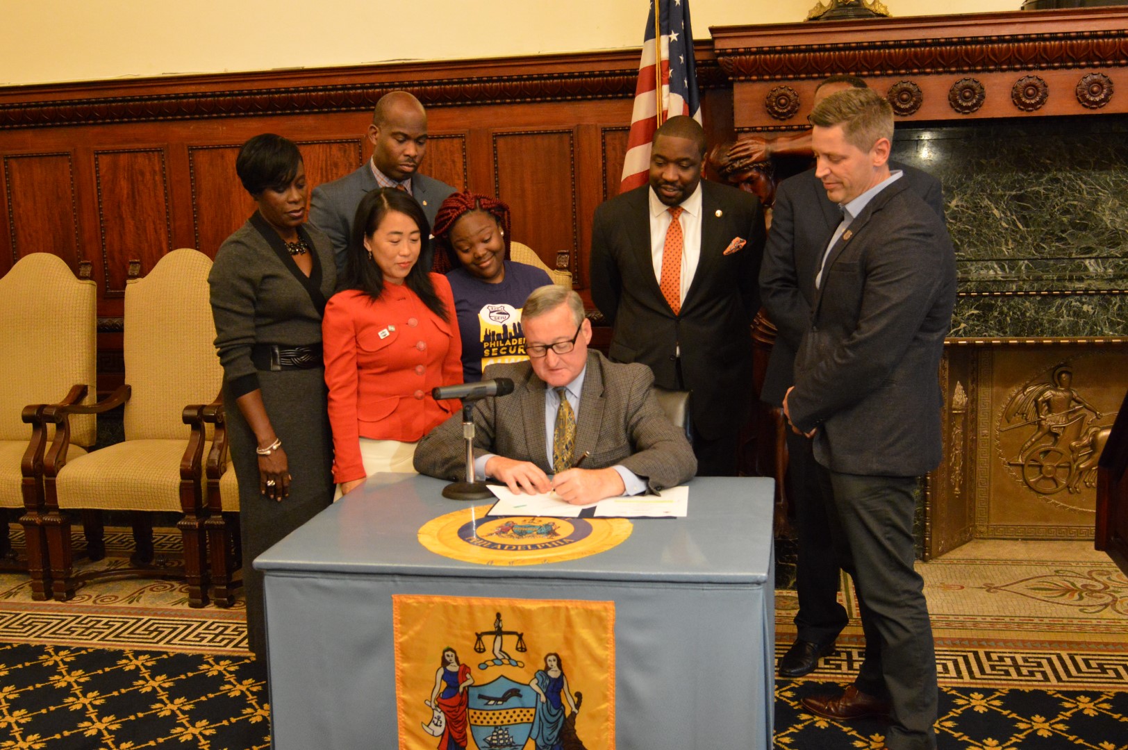 Mayor Kenney signs bill (Tom MacDonald Newsworks)