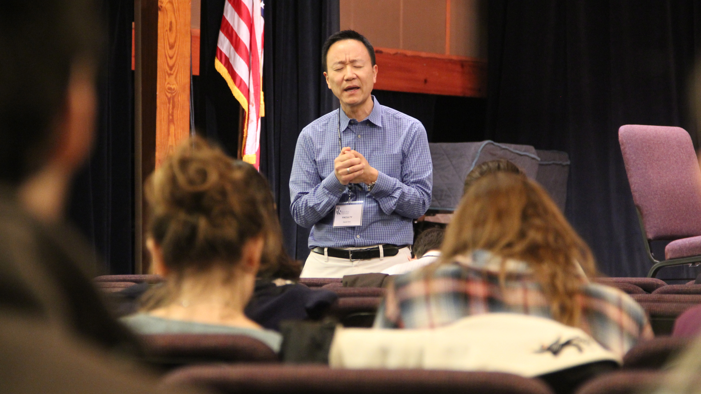David Kim says a prayer before the start of his Orchestral Institute at Cairn University. Kim, a concertmaster for the Philadelphia Orchestra, chose the small Christian school in Langhorne, Pa., because he wanted to include spirituality in his lesson plans. (Emma Lee/WHYY)