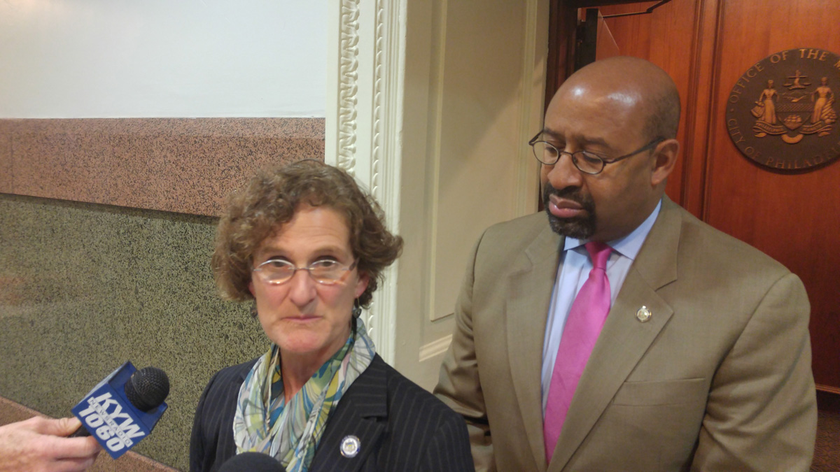  Philadelphia Inspector General Amy Kurland and Mayor Michael Nutter discuss problems found in the operations of the city's department of Licene4se and Inspections. (Tom MacDonald/WHYY) 