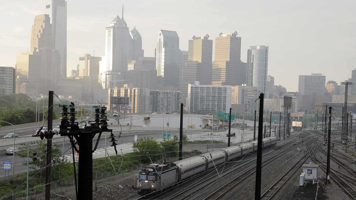  An Amtrak train travels north from 30th Street Station Monday in Philadelphia. Amtrak's Northeast Corridor trains resumed service Monday following last week's deadly derailment that killed eight people and injured more than 200 others. (Matt Slocum/AP Photo) 