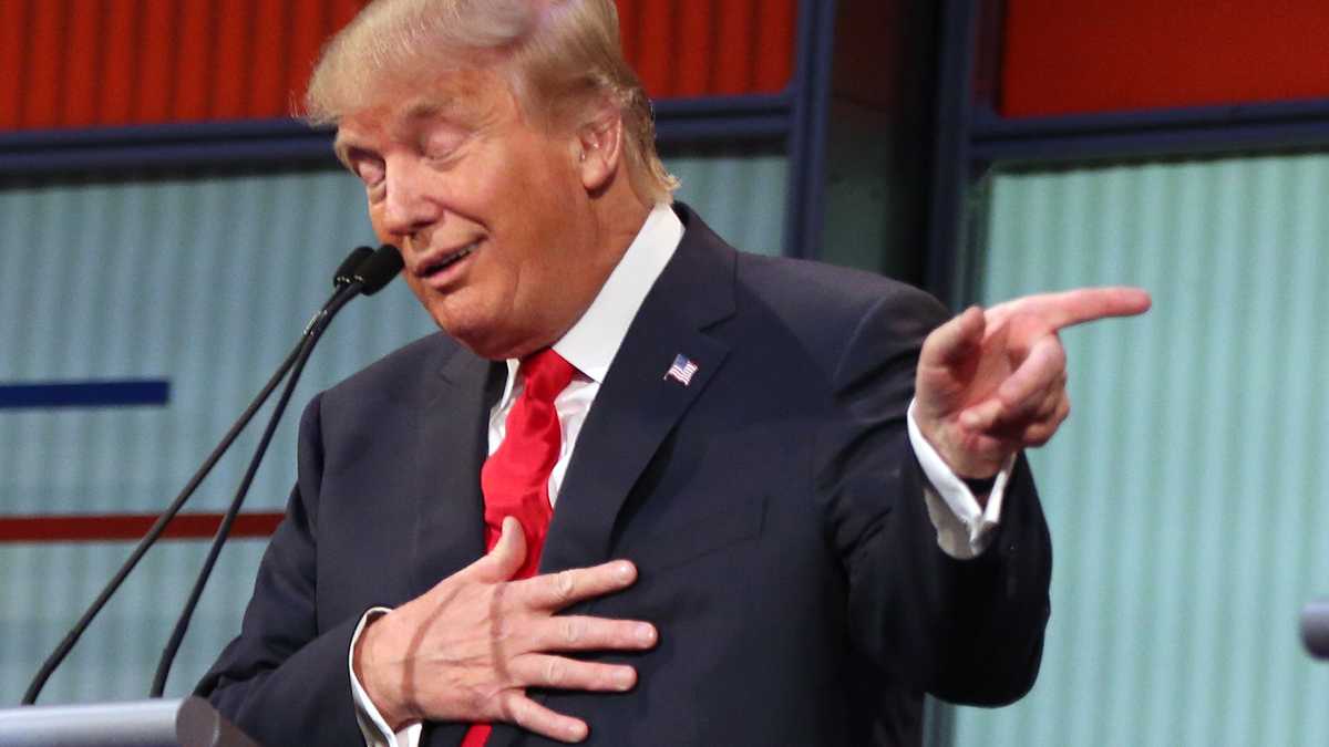  Republican presidential candidate Donald Trump responds to former Arkansas Gov. Mike Huckabee's closing remarks during the first Republican presidential debate at the Quicken Loans Arena Aug. 6 in Cleveland. (Andrew Harnik/AP Photo) 