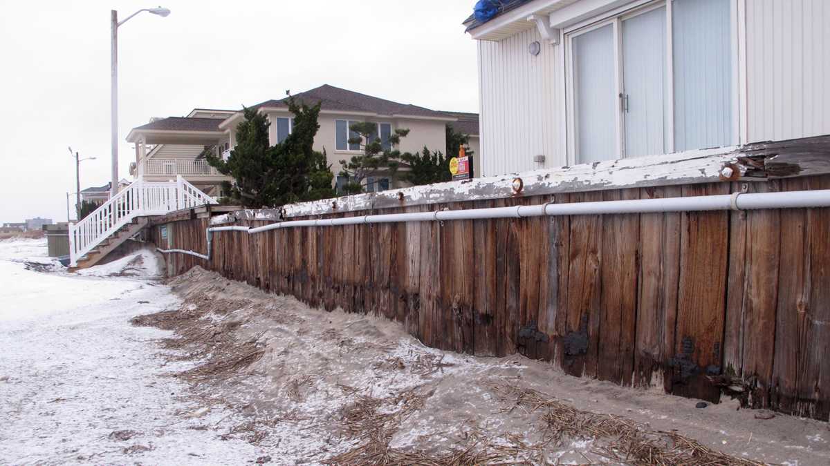 A wooden bulkhead stretches along the beachfront in Margate