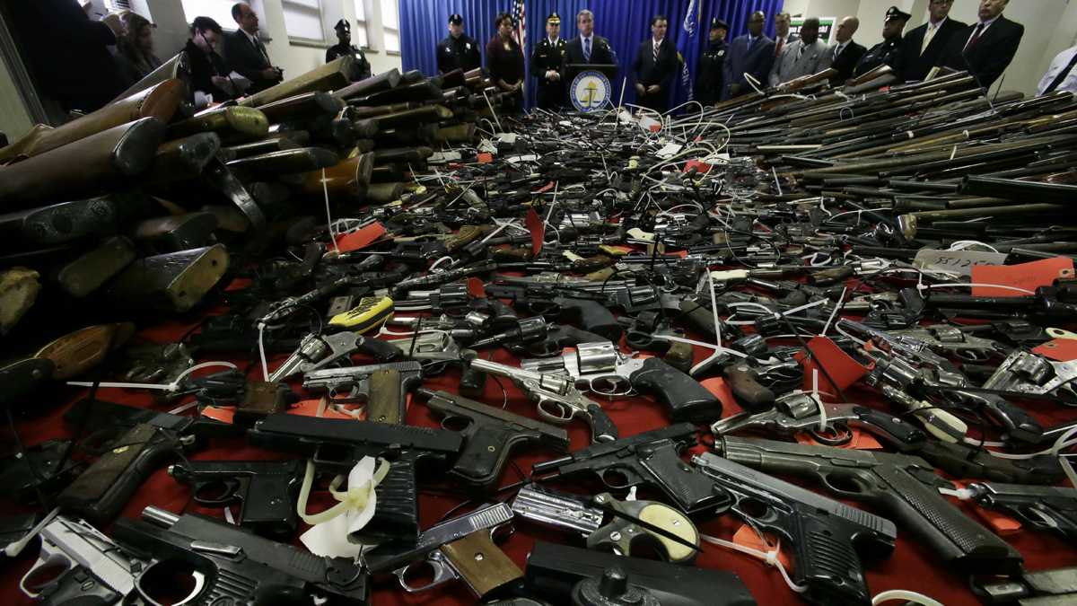  Guns cover tables in Camden, N.J., Tuesday, Dec. 18, 2012. (Mel Evans/AP Photo, file) 