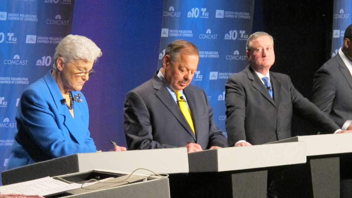  Mayoral candidate Lynne Abraham takes notes Tuesday night during a debate aired live on NBC10. Minutes later, she collapsed on the stage. (Katie Colaneri/WHYY)  
