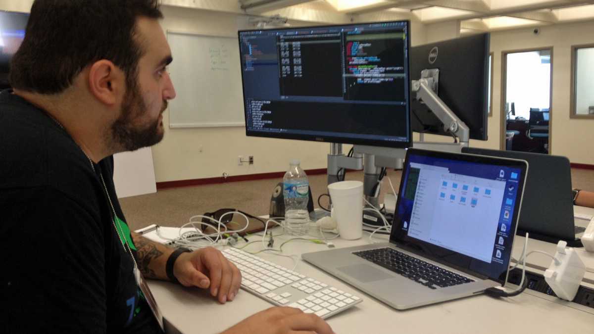 Sean Strauss tackles a coding challenge as part of the 90-day Zip Code Wilmington boot camp. (Avi Wolfman-Arent/WHYY)