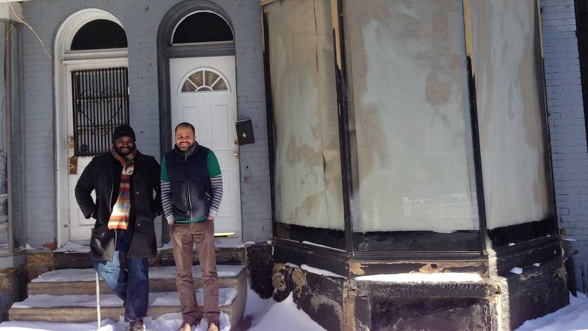  Jimmie Reed (left) and Jimmy Duran stand in front of 26 Maplewood Mall, before it was transformed into a coffee shop, during happier times. (Neema Roshania/WHYY)  