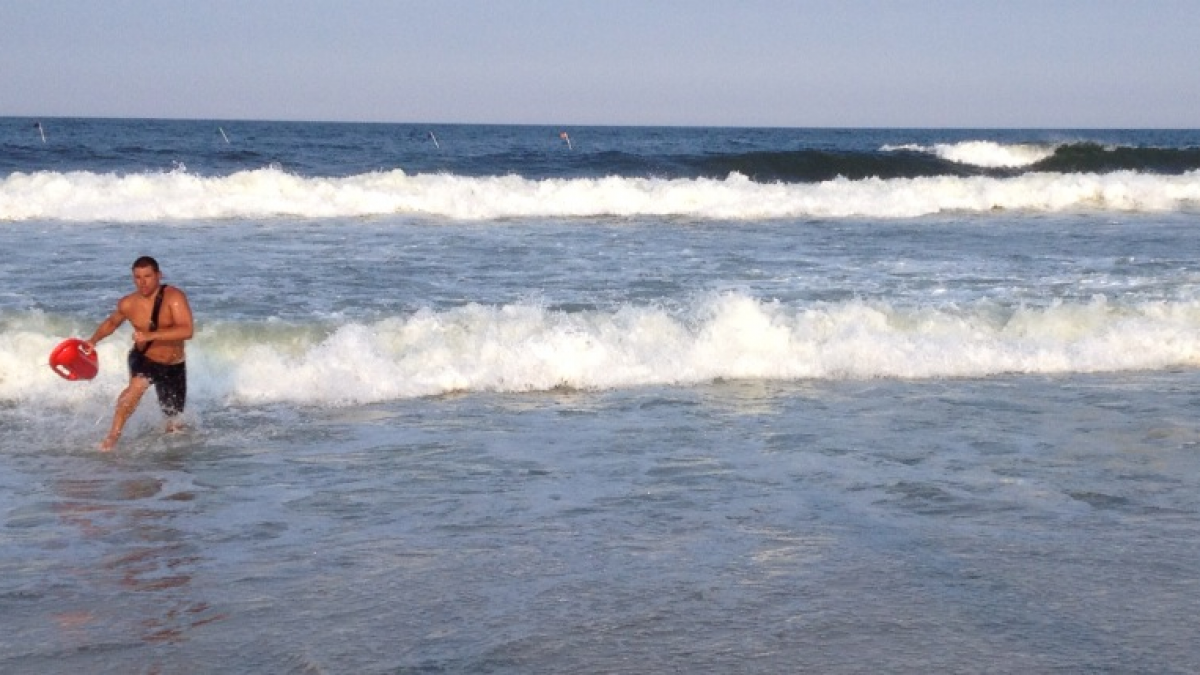 A lifeguard exiting the ocean after competing in the Seaside Park lifeguard tournament in July 2014. (Photo: Justin Auciello/JSHN)