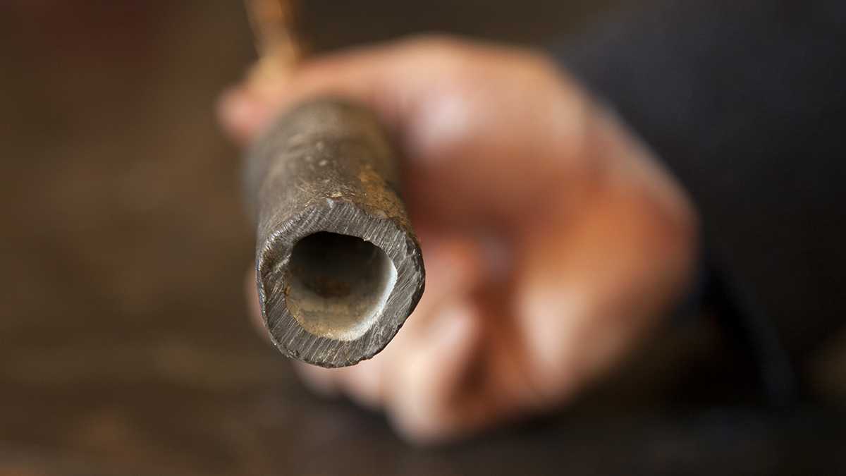 The inside of a lead pipe with a biofilm intact. Biofilms consist of organic and inorganic matter that act as a wall between the lead surface and the water. One of the EPA’s primary means of reducing lead exposure is corrosion control