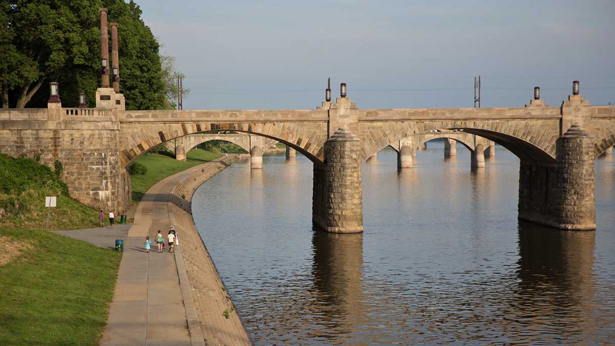  People walk along the Susquehanna River in Harrisburg, Pennsylvania. (Lindsay Lazarski/WHYY) 