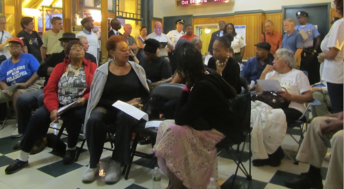  Residents discuss community issues at a meeting inside the Queen Lane Station. (Aaron Moselle/WHYY, file) 