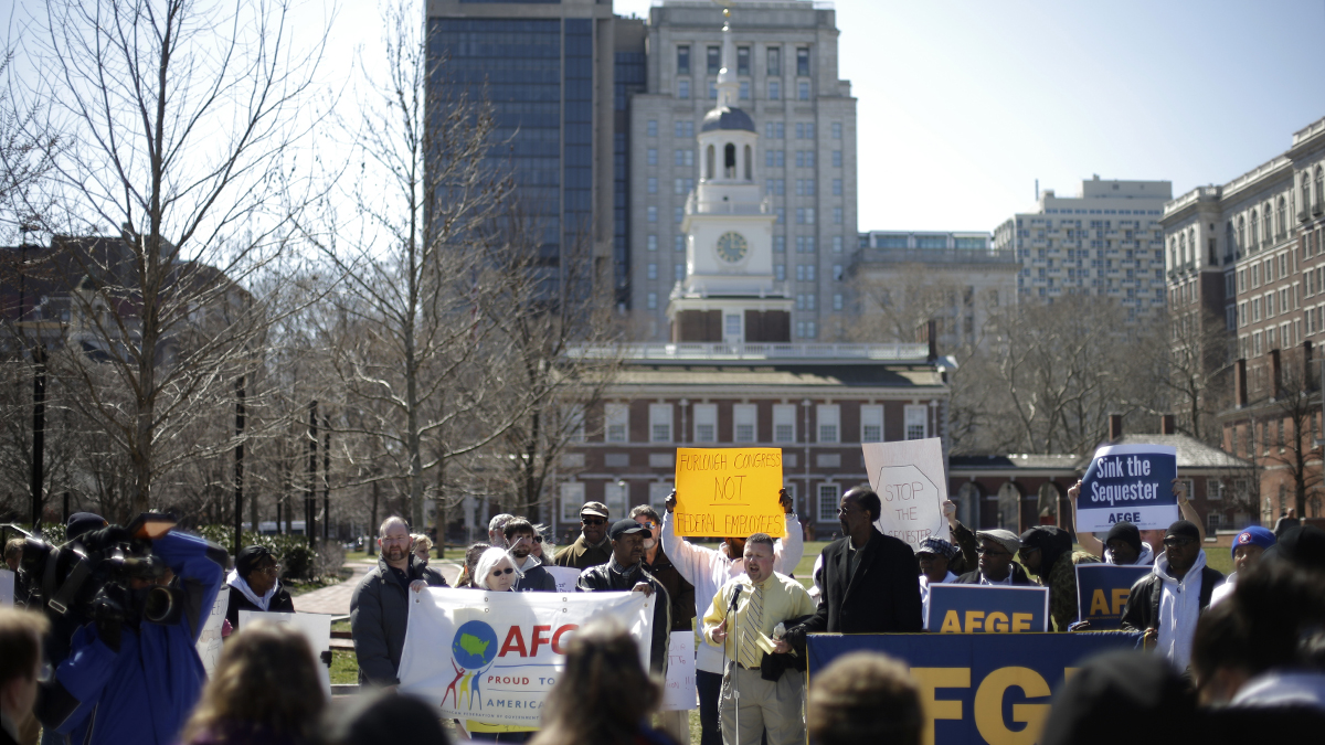  Government workers, supporting union members and activists protest against the across-the-board federal spending cuts at Independence National Historical Park, in view of Independence Hall in Philadelphia.  (AP Photo/Matt Rourke, file) 