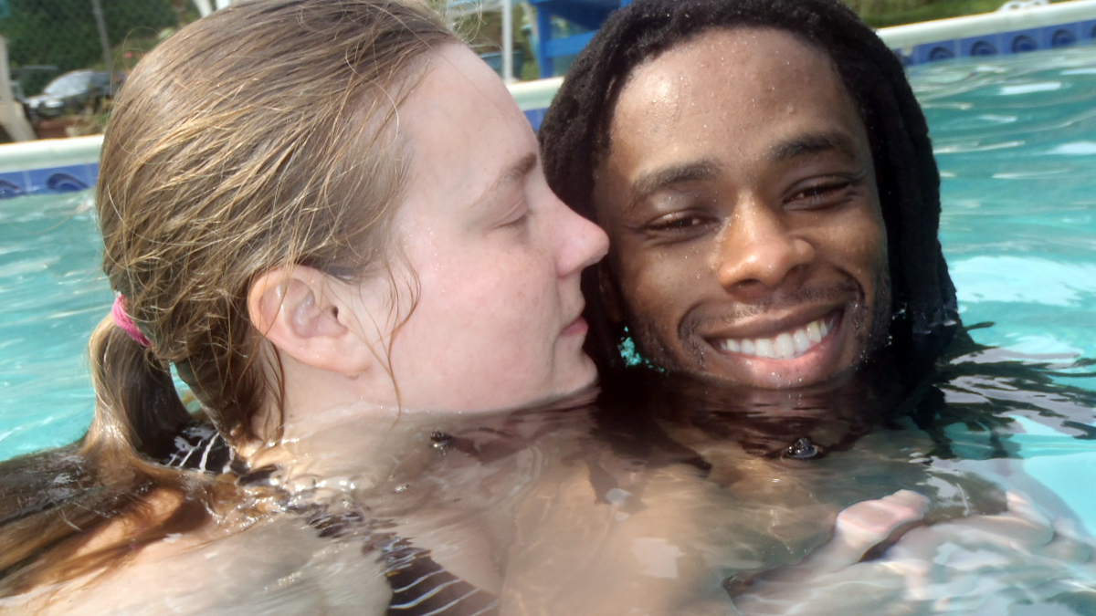  The author is shown in the pool with her husband shortly after his swimming class ended. (Image courtesy of Alaina Mabaso) 