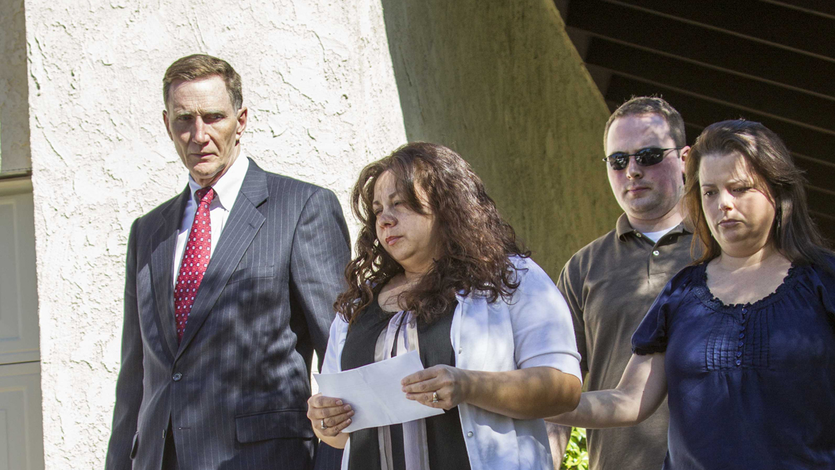  John S. Pistole, left, Administrator of Transportation Security Administration and Ana Hernandez, center, wife of TSA agent Gerardo Hernandez, victim at LAX shooting on Saturday Nov. 2, 2013.  (AP Photo/Ringo H.W. Chiu) 